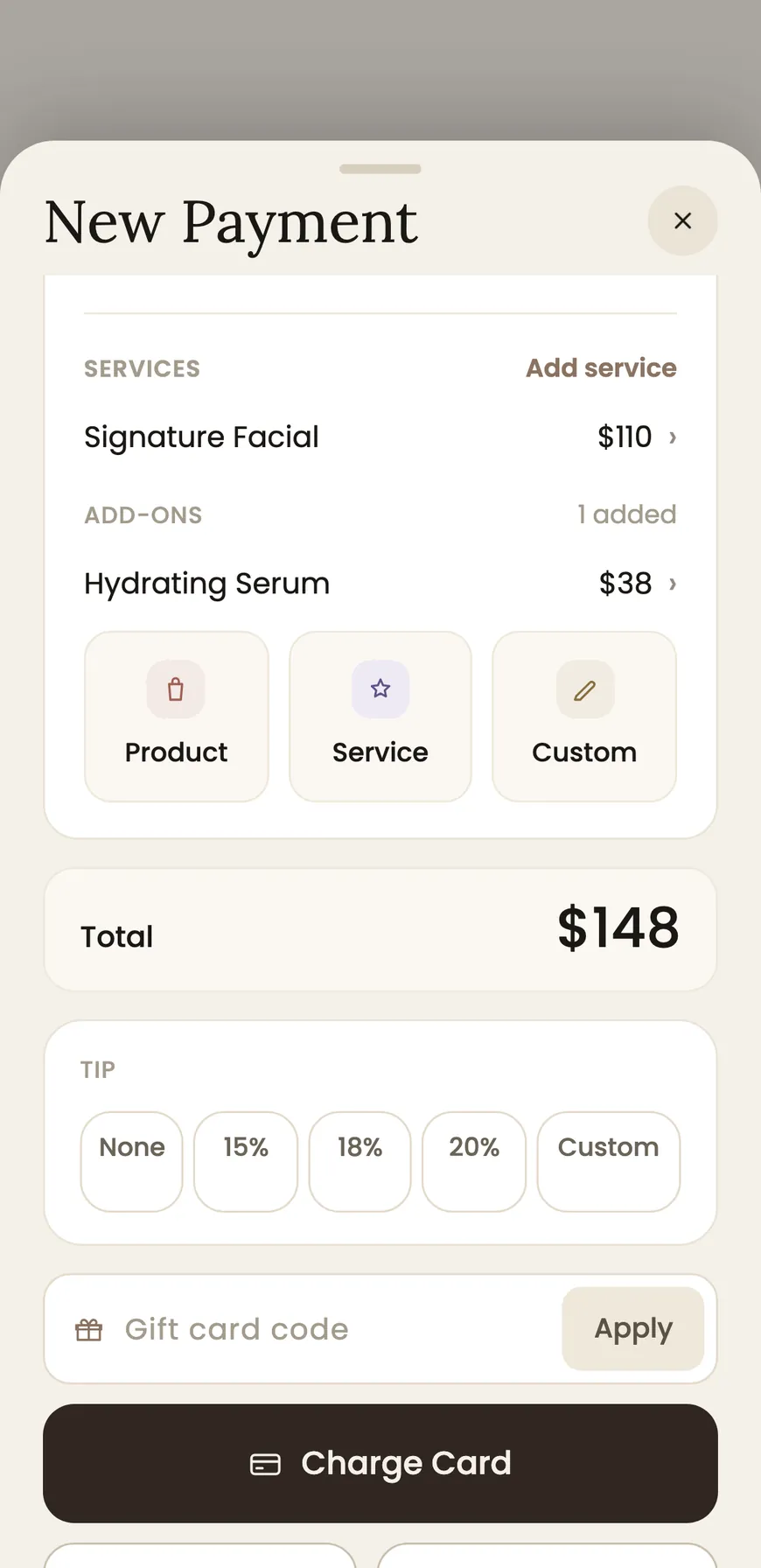 A checkout screen in BackBar, with the treatment, an aftercare product added and the total charged.